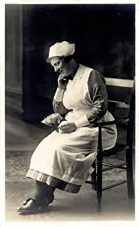 The Royal College Of Nursing: Nurse Sitting with Flowers