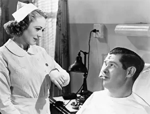Tenderness: Nurse taking patients temperature