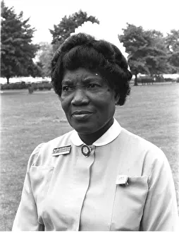 Nurse in front of trees