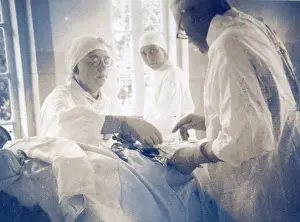 Assisting: Nurses assisting doctor during surgery