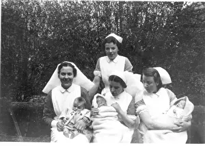 Britain British Nurse Nurses Medicine: Nurses and babies outdoors