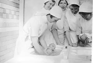 Wellbeing: Nurses bathing newborn babies