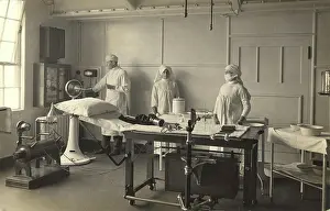 Healthcare: Two nurses and a doctor in x-ray room at King