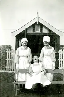 Summerhouse: Three nurses in a garden