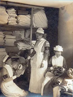 Storeroom: Three nurses in hospital storeroom, WW1