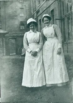 Wheelchair: Two nurses outside institution
