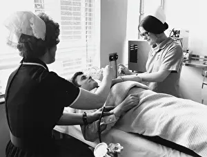 Injection: Nurses and patient at the Medical Centre, Hendon