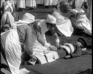 Practising: Nurses Practising Applying Bandages To A Soldier