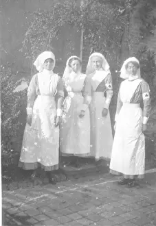 Armbands: Four nurses in uniform, with red cross armbands