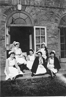 Jarrett: Six nurses and woman on steps