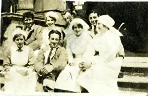 Informal: Four nurses and wounded servicemen on steps