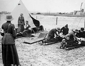 Applying: Nurses Yeomanry Corps apply first aid behind the front line