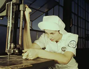 Servicing: A NYA trainee learning to operate a cutting machine, 1942