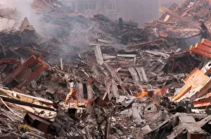 Smouldering: NYC Fire fighter walks over smouldering fires and