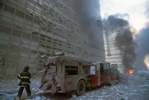 Nyfd: NYC fireman pulling water hose from fire truck after