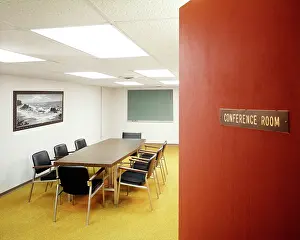 Ajar: Office Space Door Ajar with View into Empty Conference Room