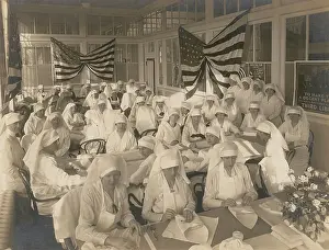 Folding: Office workers volunteering to pack bandages