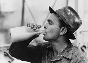 Kilgore: Oil field worker drinking a bottle of milk at lunch, Kilgore