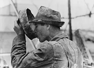 Kilgore: Oil field worker drinking water from a crude ?