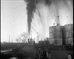 Spout: Oil Gushing Out of a Spout in the Ground At