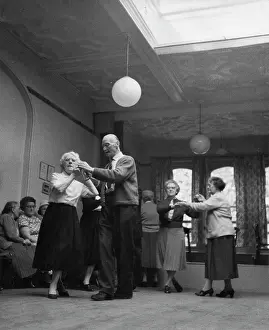 Widowhood: Old-aged people dancing in a club