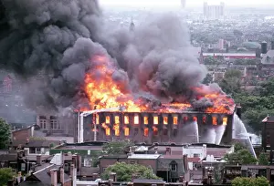 Engulfed: Old Brick Warehouse Engulfed in Flames and Smoke
