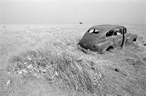 Rusted: Old car abandoned in a field during a drought in 1987
