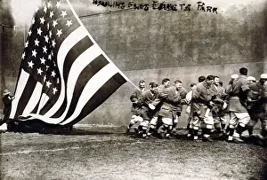 Old Glory. Group of men raising large American ?