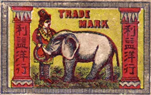 Matchboxes: Old Japanese Matchbox label with a man with an elephant