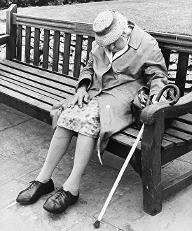 Dozing: Old Lady asleep on park bench