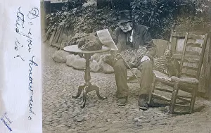 Battered: Old man with two dogs and a cat in a garden