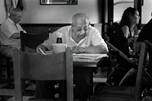Menorca: Old man sits in Toni's Bar in Escastell, near Mahon, Menorca