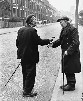 Decay: Two old men chat on a Manchester street