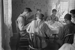 Shahn: Old and young farmers having a full dinner ?