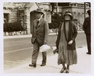 Strolls: Rather serious older couple on holiday at Torquay, Devon