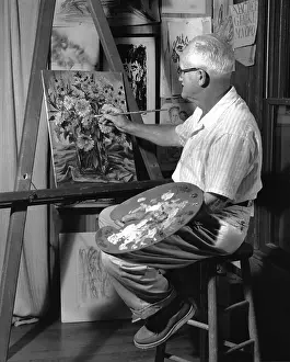 Pallet: Older Man Doing a Painting on an Easel