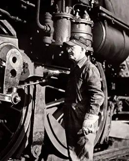 Oiling: Older Man Railroad Locomotive Engineer Oiling