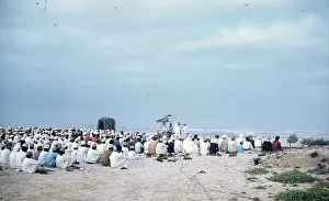 Easterni: Omani Elders looking towards the sea on a beach in Oman
