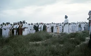Salalah: Omani elders stand with heads bowed in Oman