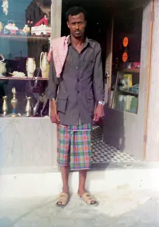 Stickers: Omani man standing in front of a shop in Oman