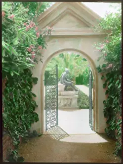 Wrought: Open gateway into an Italian garden