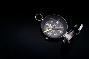Jac003: Open Magnetic Military Compass on Black Background