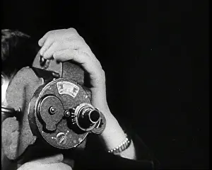 Someone: Someone Operating a Camera
