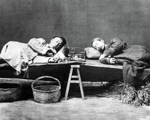 Smokers: Two opium smokers, China