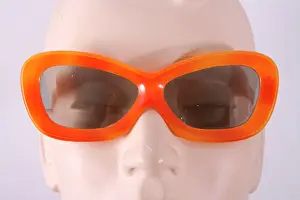 Lenses: Orange oblong plastic frame sunglasses, green