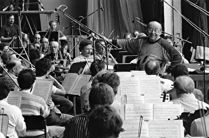 Conducts: Orchestra rehearsal