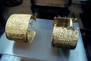Gregorian: Two oriental-style embossed gold bracelets