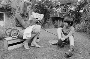 Spelling: Outdoor lesson at a children's home