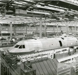 Fuselage: Overhead cranes at Lockheed-Georgia move the first Lockh