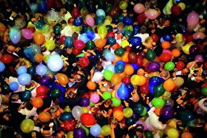 Partygoers: Overhead View Crowd of Partygoers Heads and Balloons